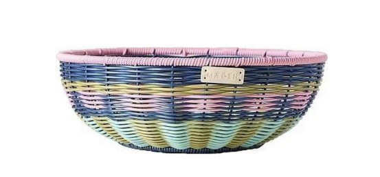Colorful woven fruit bowl for kitchen countertop decor, a practical and pretty gift for young women starting out on their own.