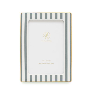 Striped picture frame displaying a family photo, a thoughtful keepsake for grandparents.