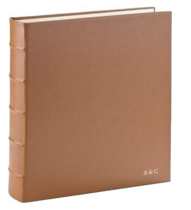 Customizable leather ring photo album, a personalized holiday gift for grandparents to preserve family photos and memories.